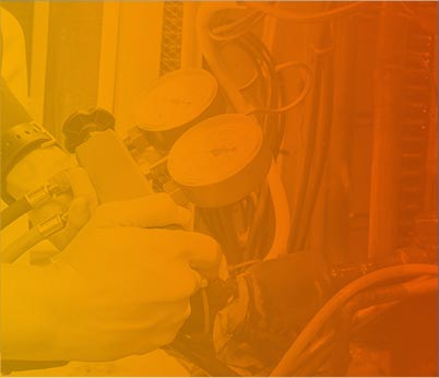 Hands operating HVAC gauges for heating and cooling service maintenance, emphasizing expertise in air conditioning and heating repairs.