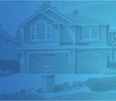 Residential home with a blue overlay, showcasing a two-car garage and landscaped front yard, representing comfort and reliability in HVAC services by Crowe's Comfort Solutions in Pooler, GA.