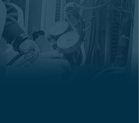 Technician using HVAC equipment for maintenance and repair services, emphasizing expertise in heating and cooling solutions.