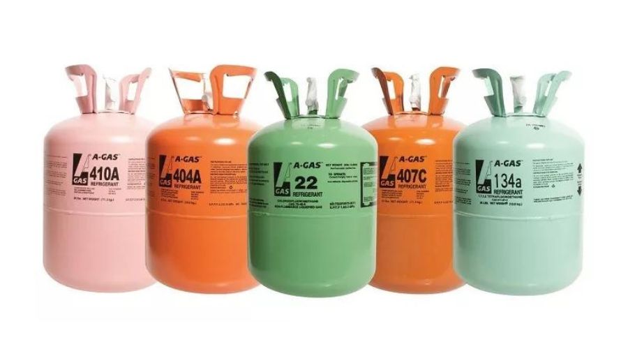 Refrigerant gas cylinders in various colors and types, essential for air conditioning systems, illustrating the importance of correct refrigerant selection for HVAC maintenance.